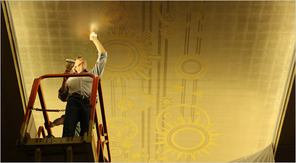 Bill Mensching restores murals. Photo by Ozier Muhammad/The New York Times