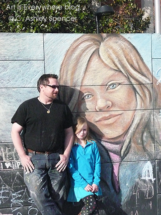 Sam Welty with Lily & his chalk portrait. Photo by Piers Spencer Sam Welty with Lily & his chalk portrait. Photo by Piers Spencer